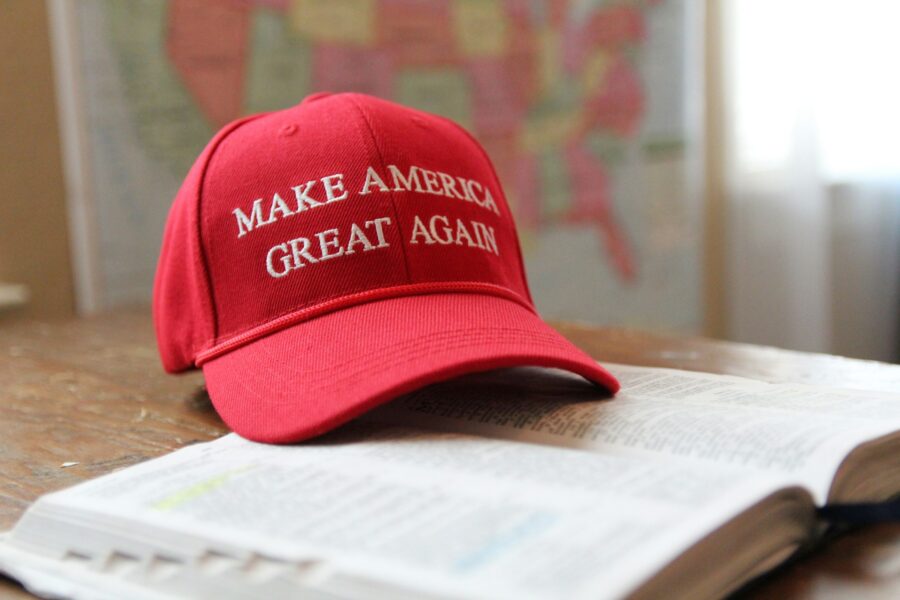 A red hat that reads Make America Great Again by Natilyn Hicks Photography on Unsplash.